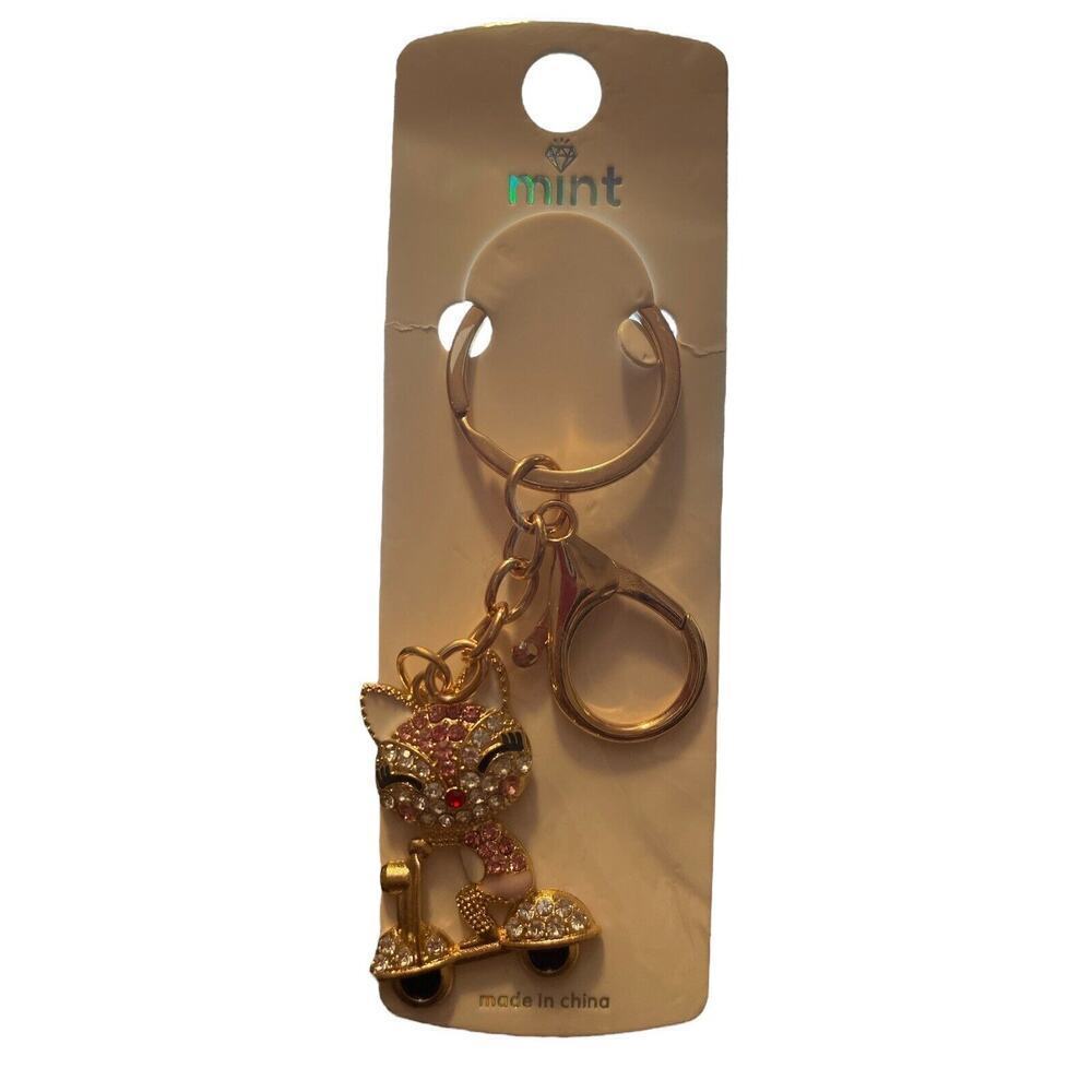 MINT SPARKLER CAT ON BIKE KEY CHAIN
